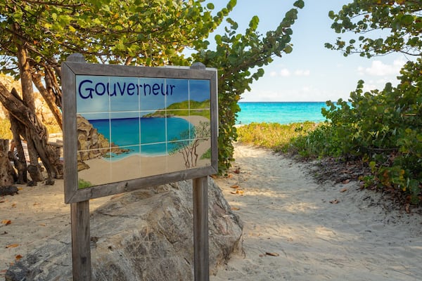 Gouverneur Beach showing a sandy beach and signage