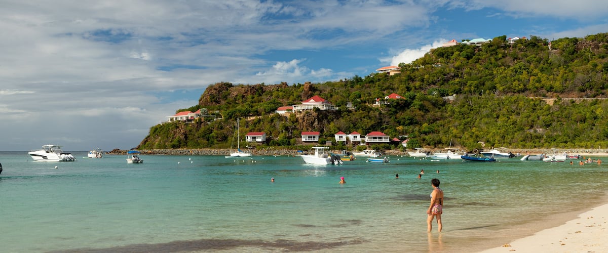 St. Jean Beach showing a coastal town, general coastal views and swimming