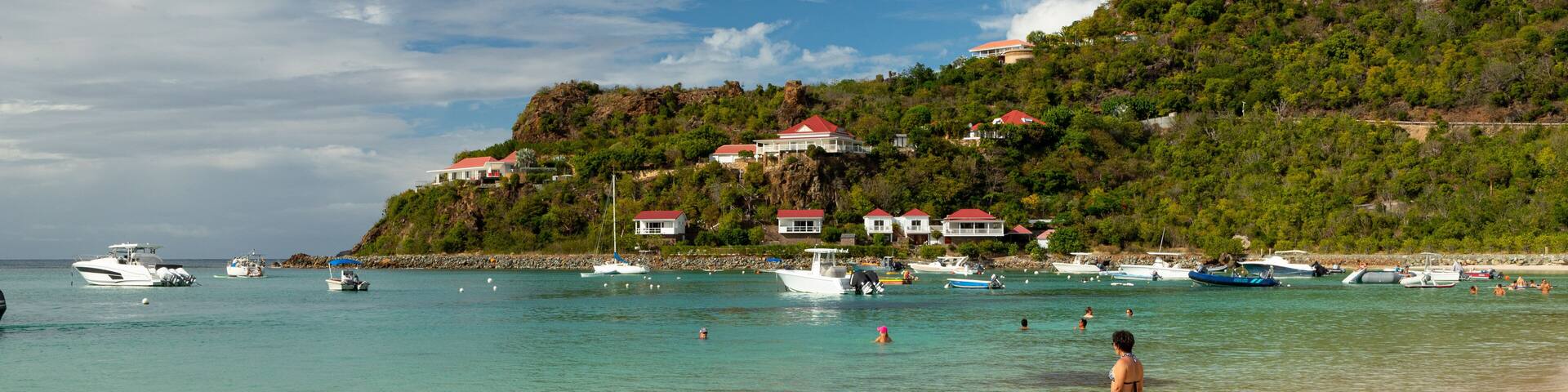 St. Jean Beach showing a coastal town, general coastal views and swimming