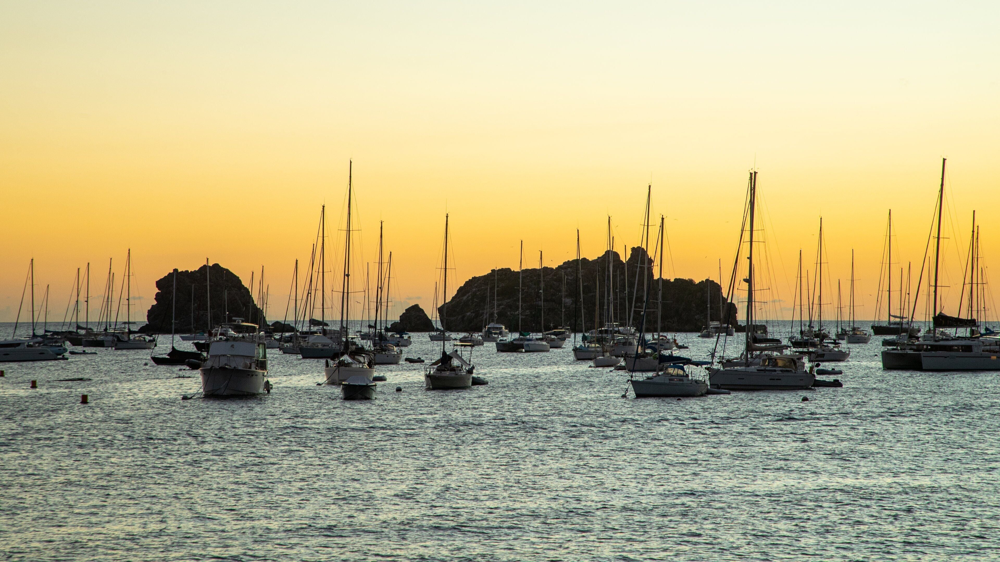 Gustavia Harbor showing general coastal views, a bay or harbor and a sunset