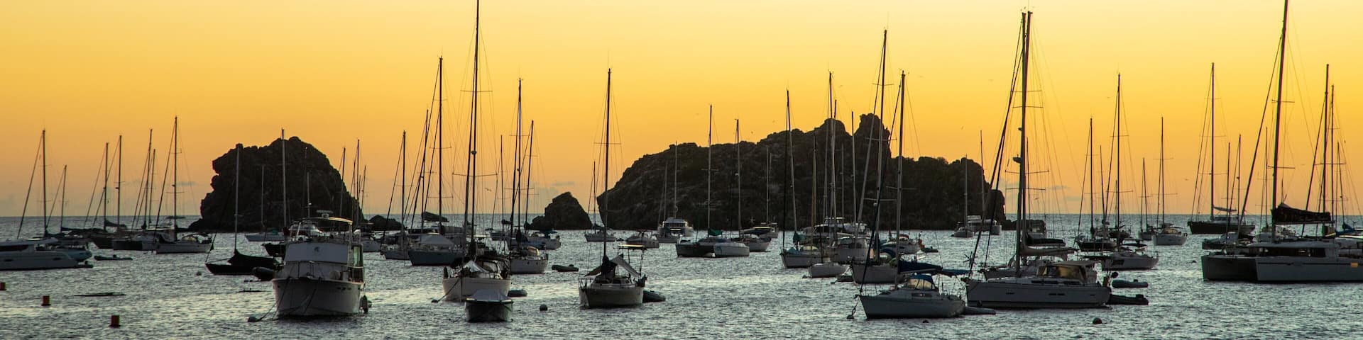 Gustavia Harbor showing general coastal views, a bay or harbor and a sunset