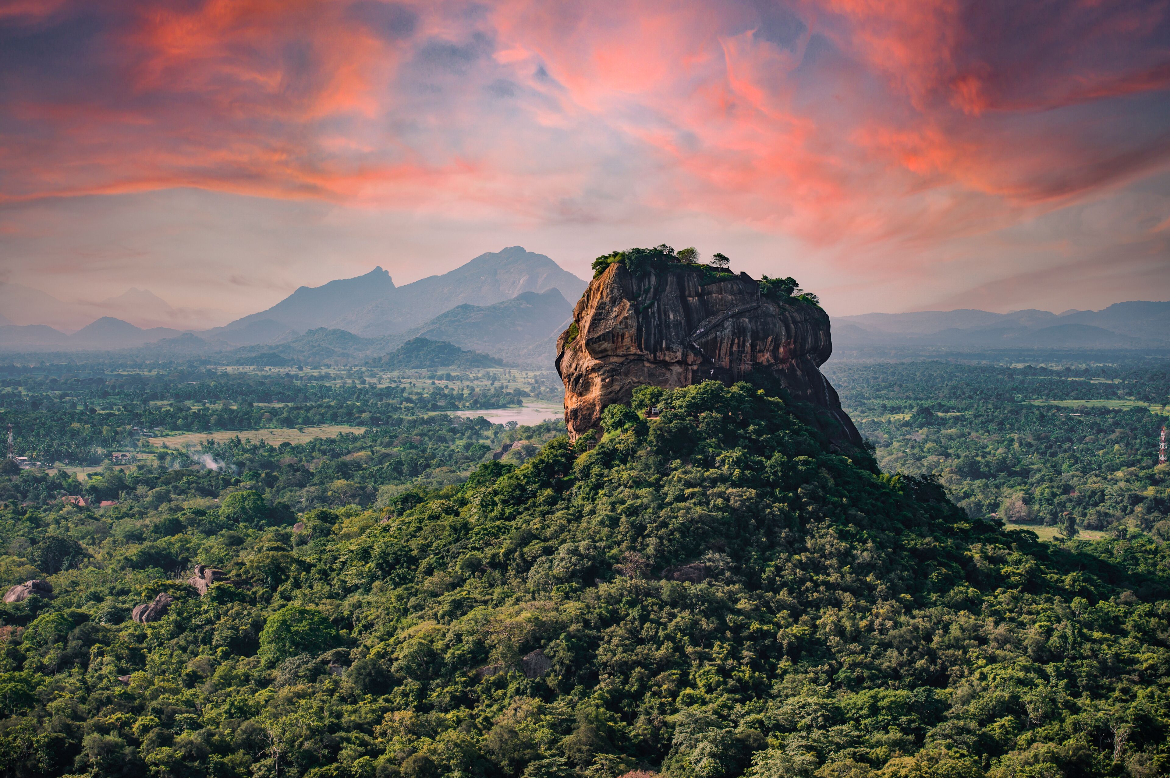 Spectacular view of the Lion rock surrounded by green rich vegetation. Picture taken from Pidurangala Rock in Sigiriya, Sri Lanka.