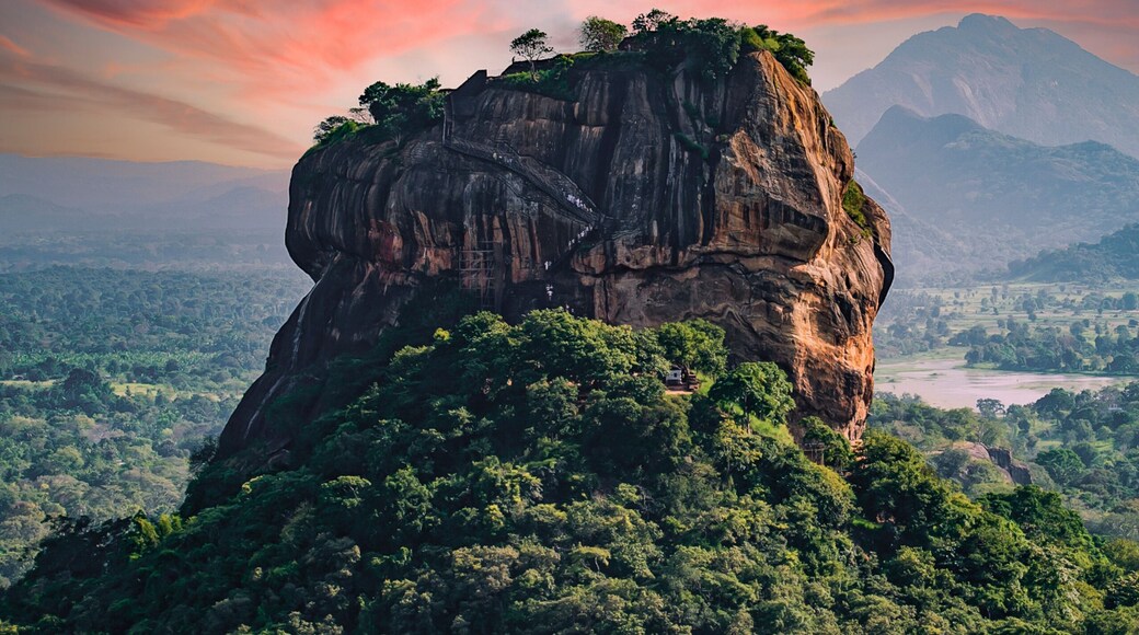 Spectacular view of the Lion rock surrounded by green rich vegetation. Picture taken from Pidurangala Rock in Sigiriya, Sri Lanka.