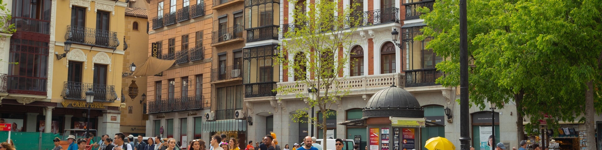 Plaza de Zocodover featuring a square or plaza and street scenes as well as a small group of people
