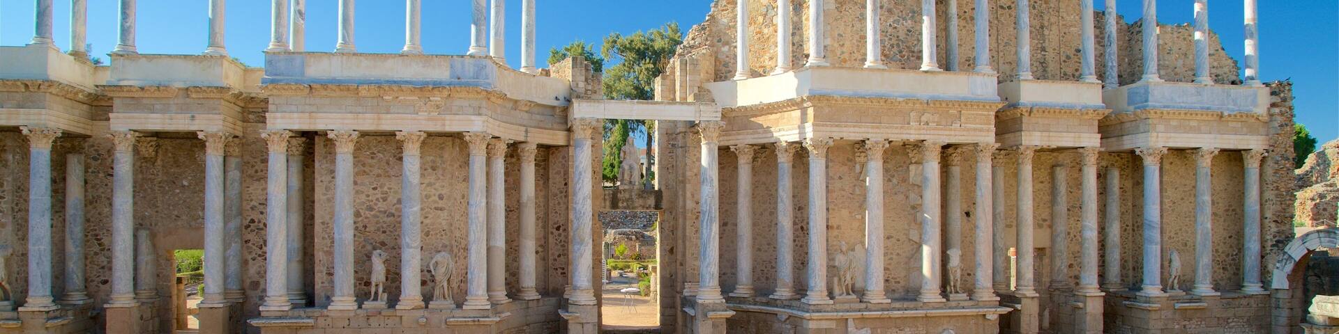 Ancient ruins with columns and arches.
