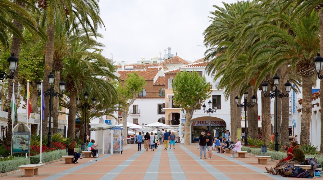 Balcon de Europa which includes street scenes and tropical scenes as well as a large group of people