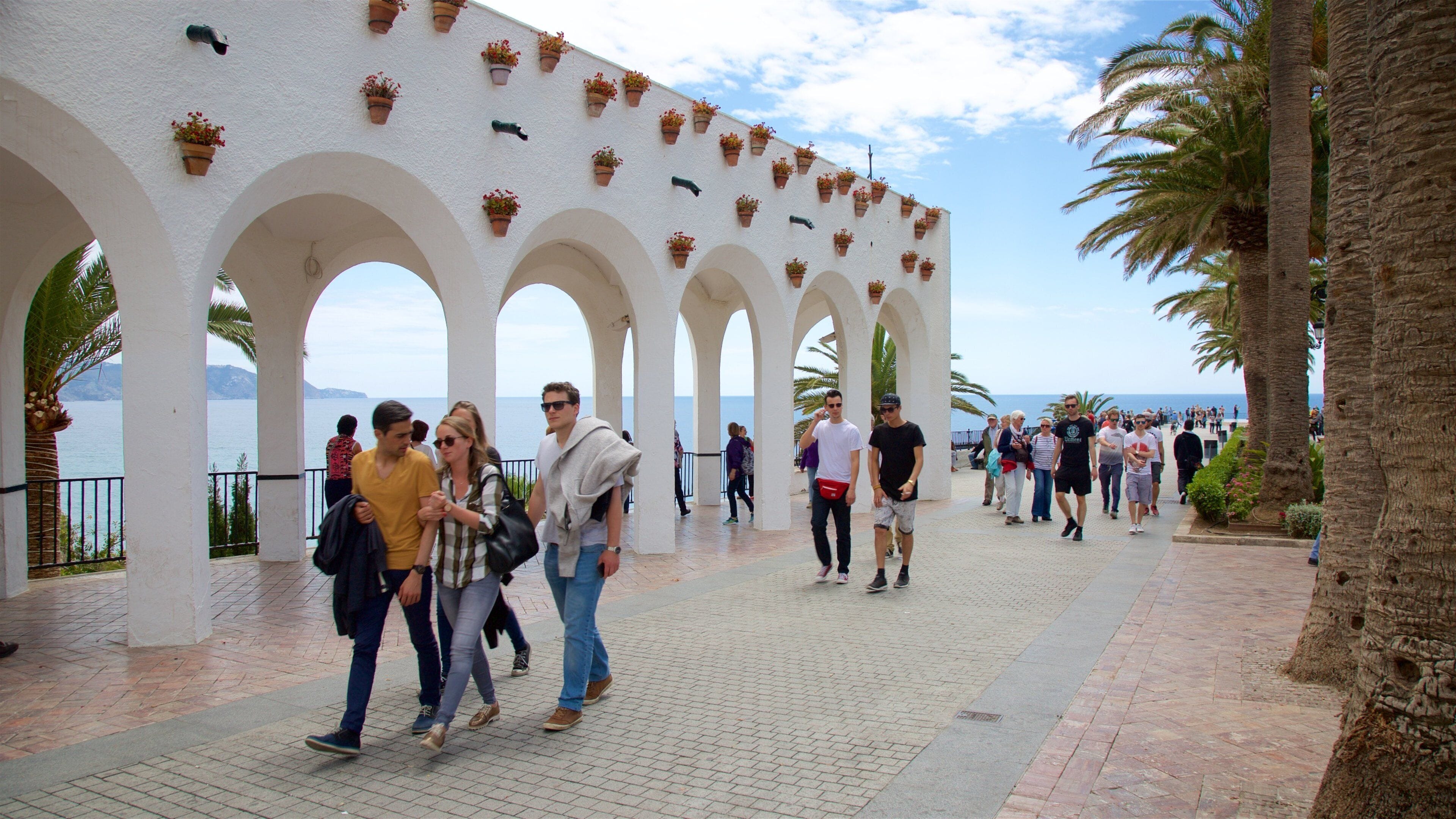 Balcon de Europa showing street scenes as well as a large group of people