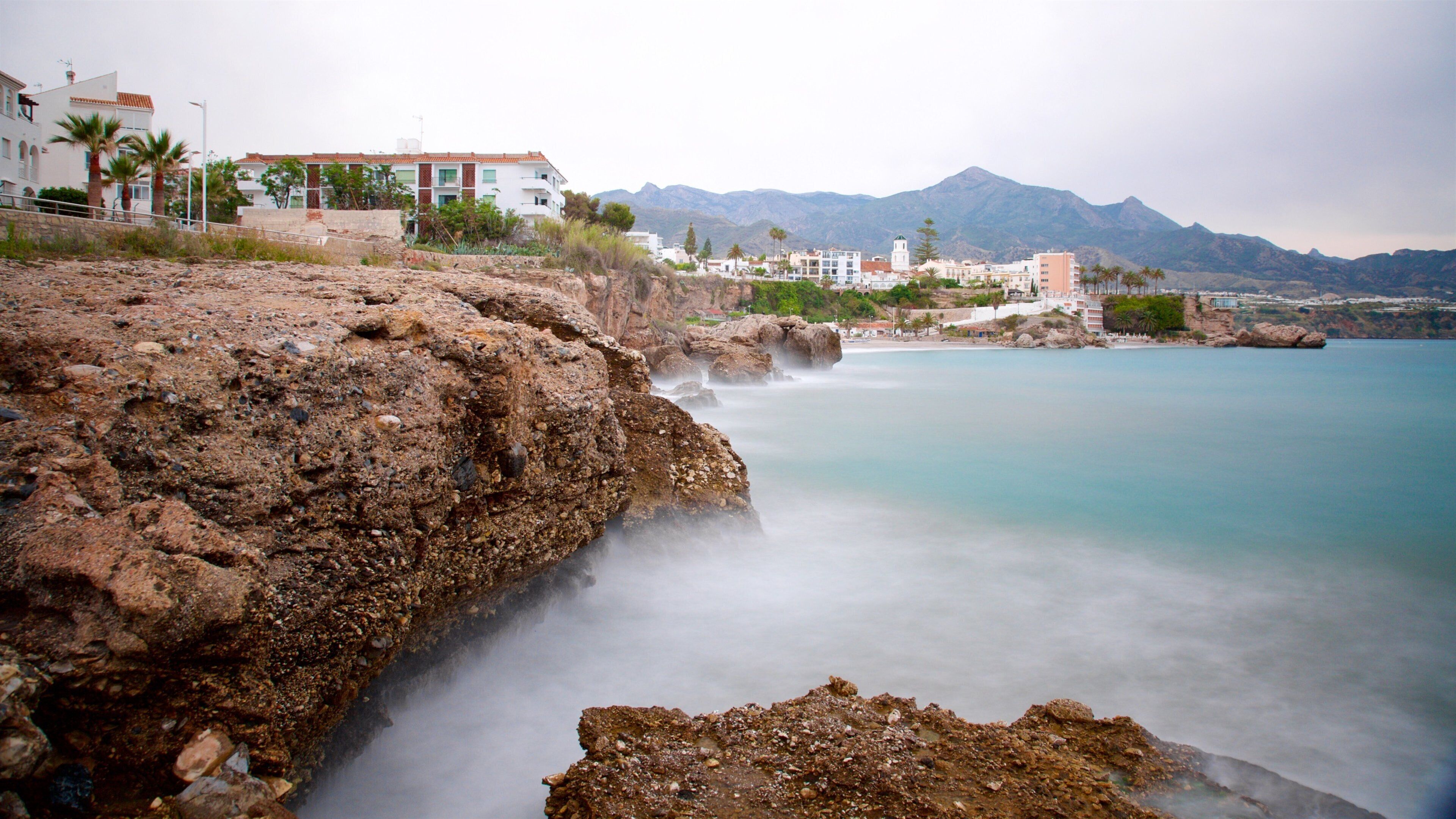 Balcon de Europa which includes general coastal views and rocky coastline