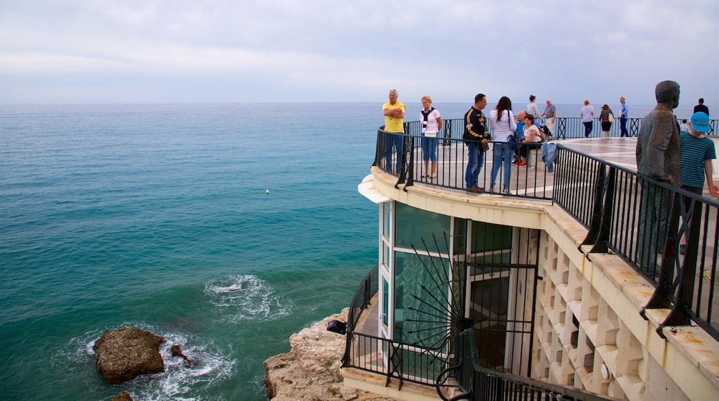 Balcon de Europa featuring general coastal views and views as well as a large group of people
