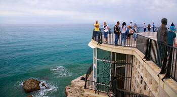 Balcon de Europa featuring views and general coastal views as well as a large group of people