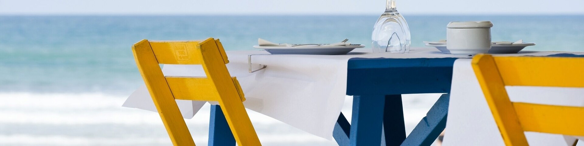 Table and chairs on the beach of Conil de la Frontera, Costa de la Luz, Andalusia, Spain, Europe