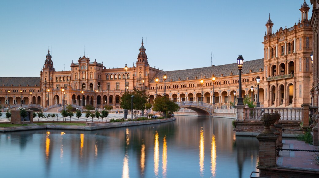 Plaza de Espana which includes a river or creek and heritage architecture