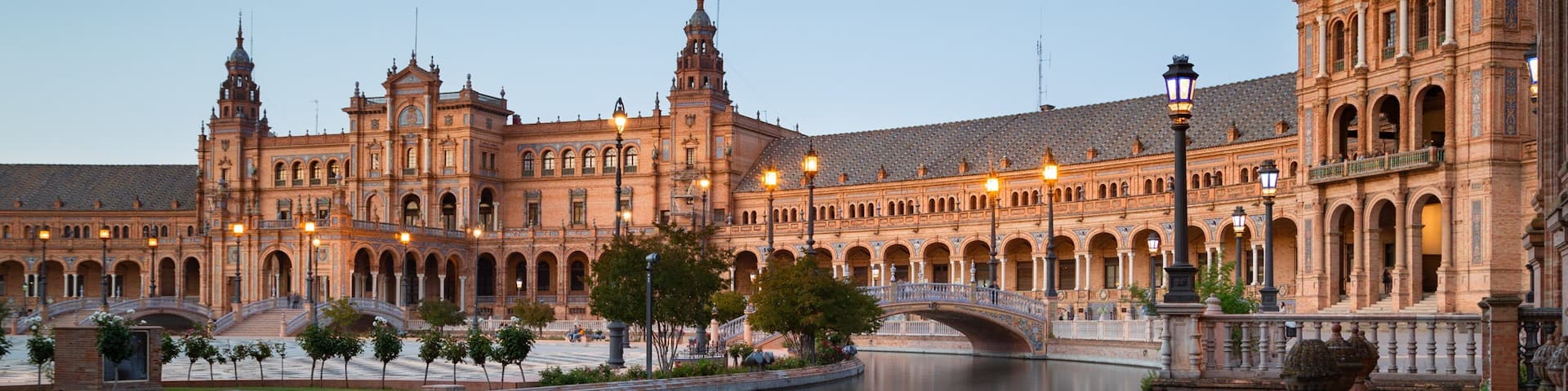 Plaza de Espana which includes a river or creek and heritage architecture