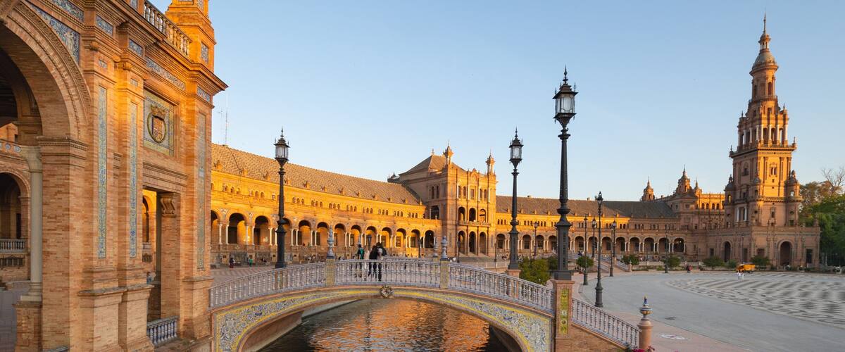 Plaza de Espana showing kayaking or canoeing, a sunset and heritage architecture