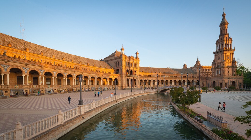 Plaza de Espana featuring a sunset, heritage architecture and a river or creek