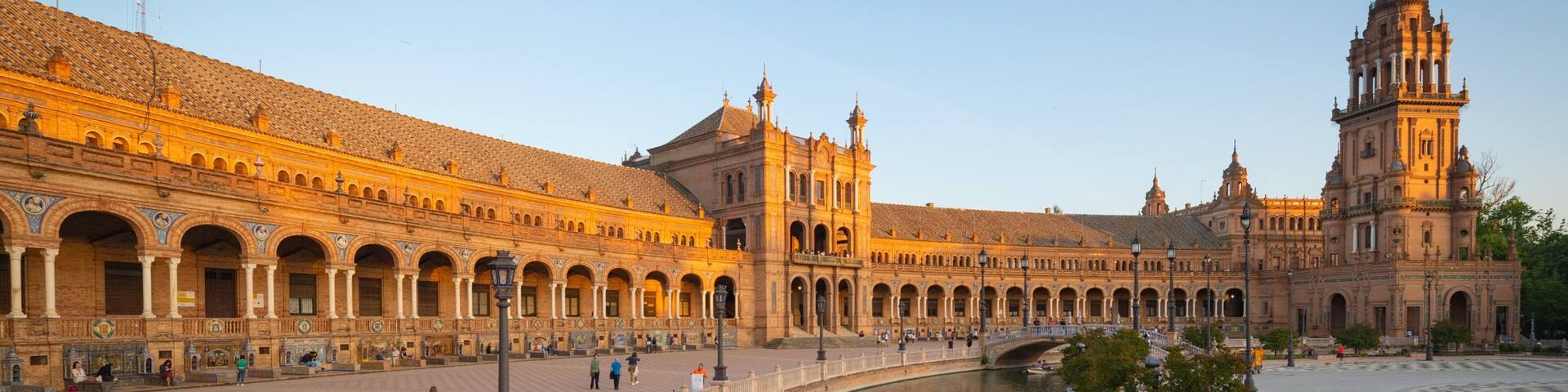 A historic building with a river in front.