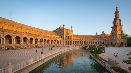 Plaza de Espana featuring a sunset, heritage architecture and a river or creek