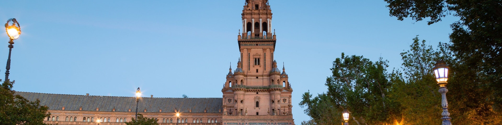 Plaza de Espana which includes a river or creek and heritage architecture
