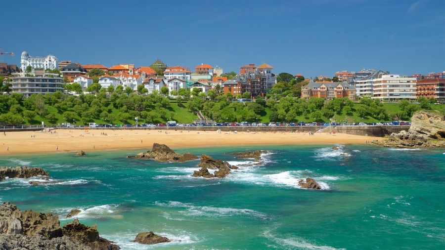 El Sardinero Beach showing rocky coastline, a sandy beach and general coastal views