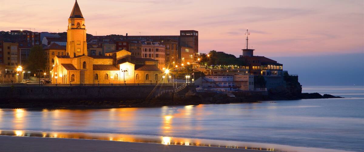 San Lorenzo Beach which includes a church or cathedral, a sandy beach and general coastal views