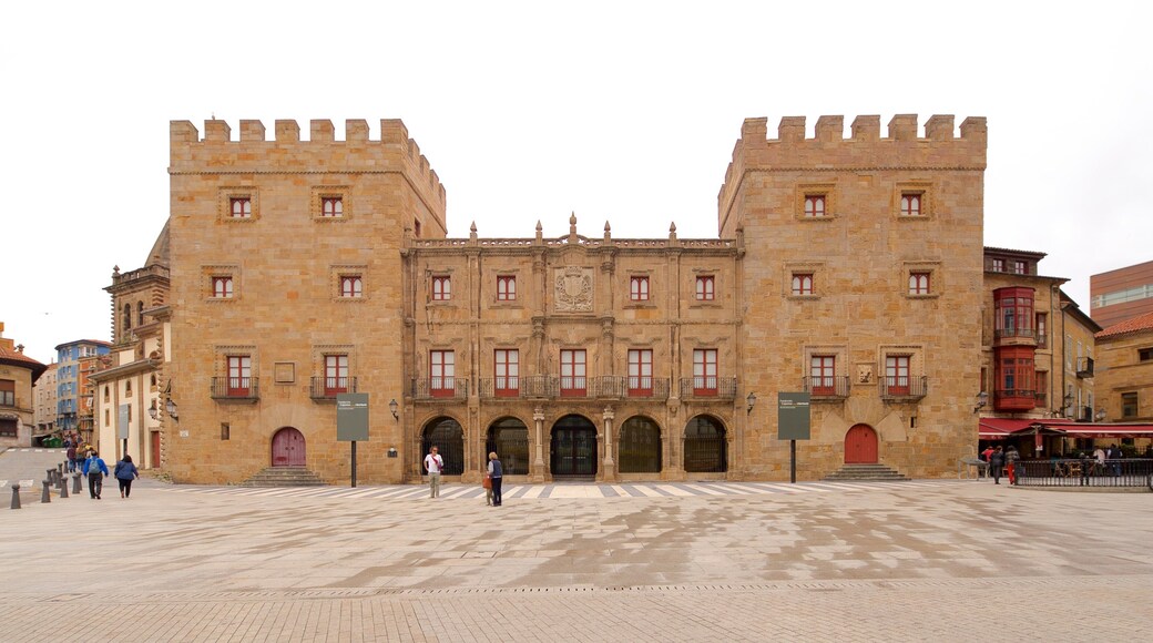 Palacio de Revillagigedo which includes a square or plaza and heritage architecture