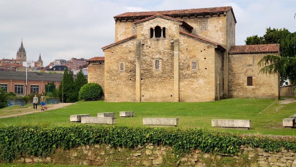 San Julian de los Prados showing heritage architecture, hiking or walking and a city