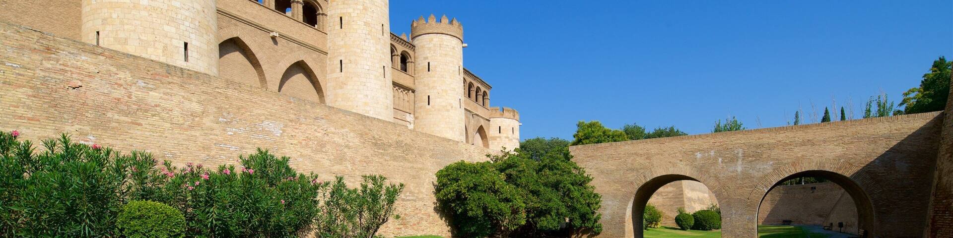 A medieval castle with multiple towers and arched walkways.