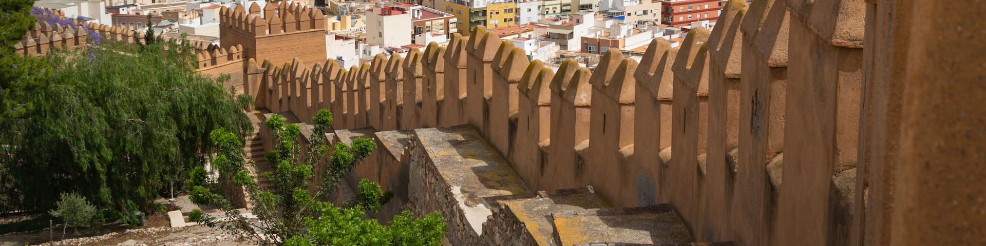 Alcazaba showing heritage elements, a coastal town and landscape views