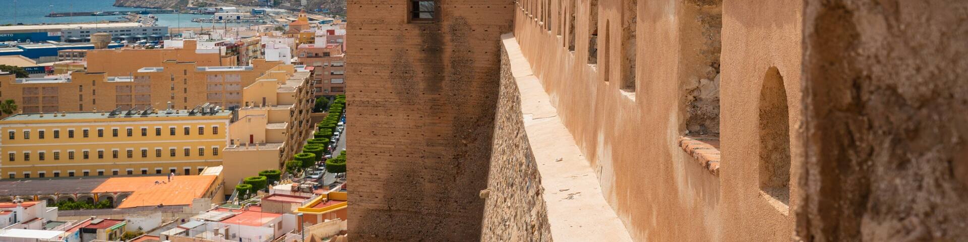 Alcazaba which includes heritage elements and a coastal town