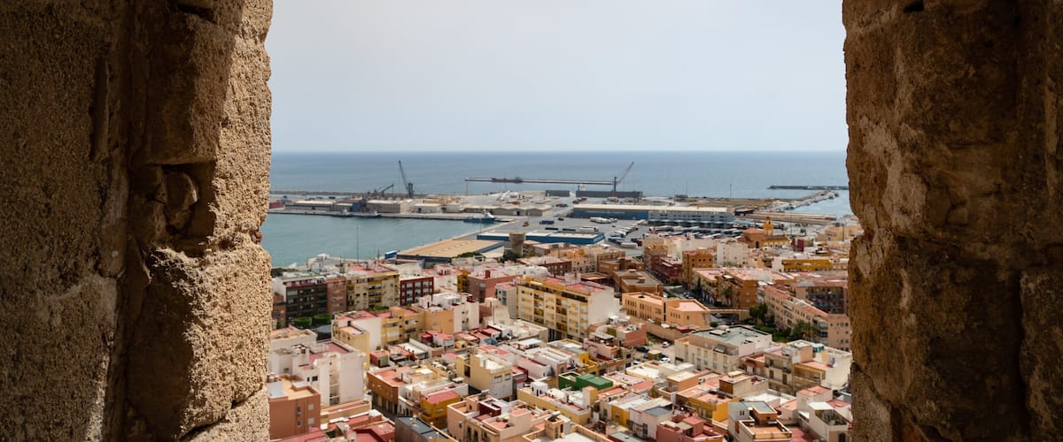 Alcazaba featuring landscape views and a coastal town