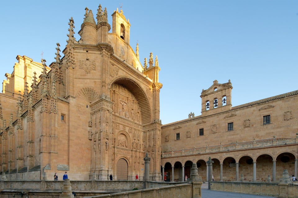 A historic cathedral with intricate facade carvings and a bell tower.
