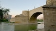 Puente de Piedra showing a river or creek, heritage architecture and a bridge