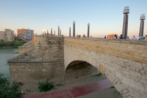 Puente de Piedra featuring a city, a river or creek and a bridge