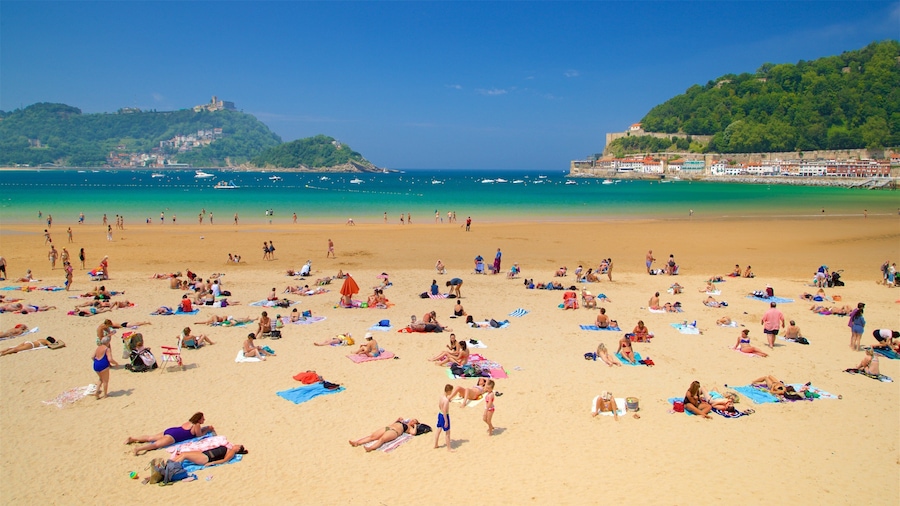 Concha Beach showing general coastal views, swimming and a coastal town