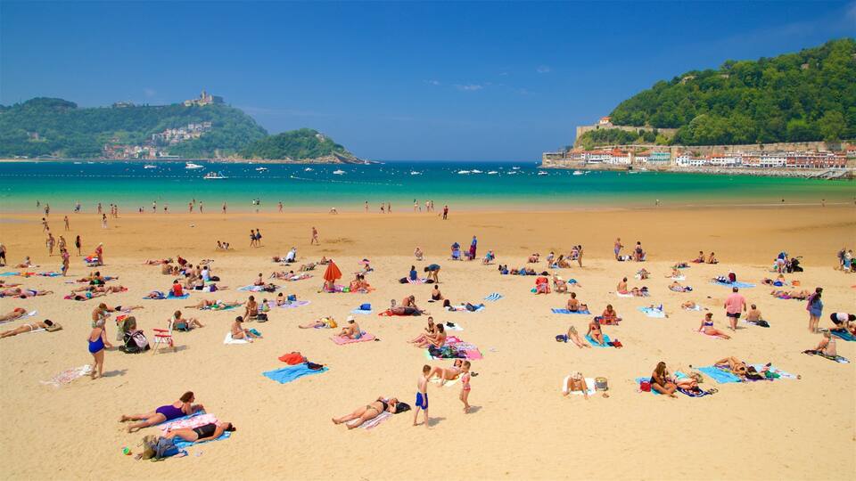Concha Beach showing general coastal views, swimming and a coastal town