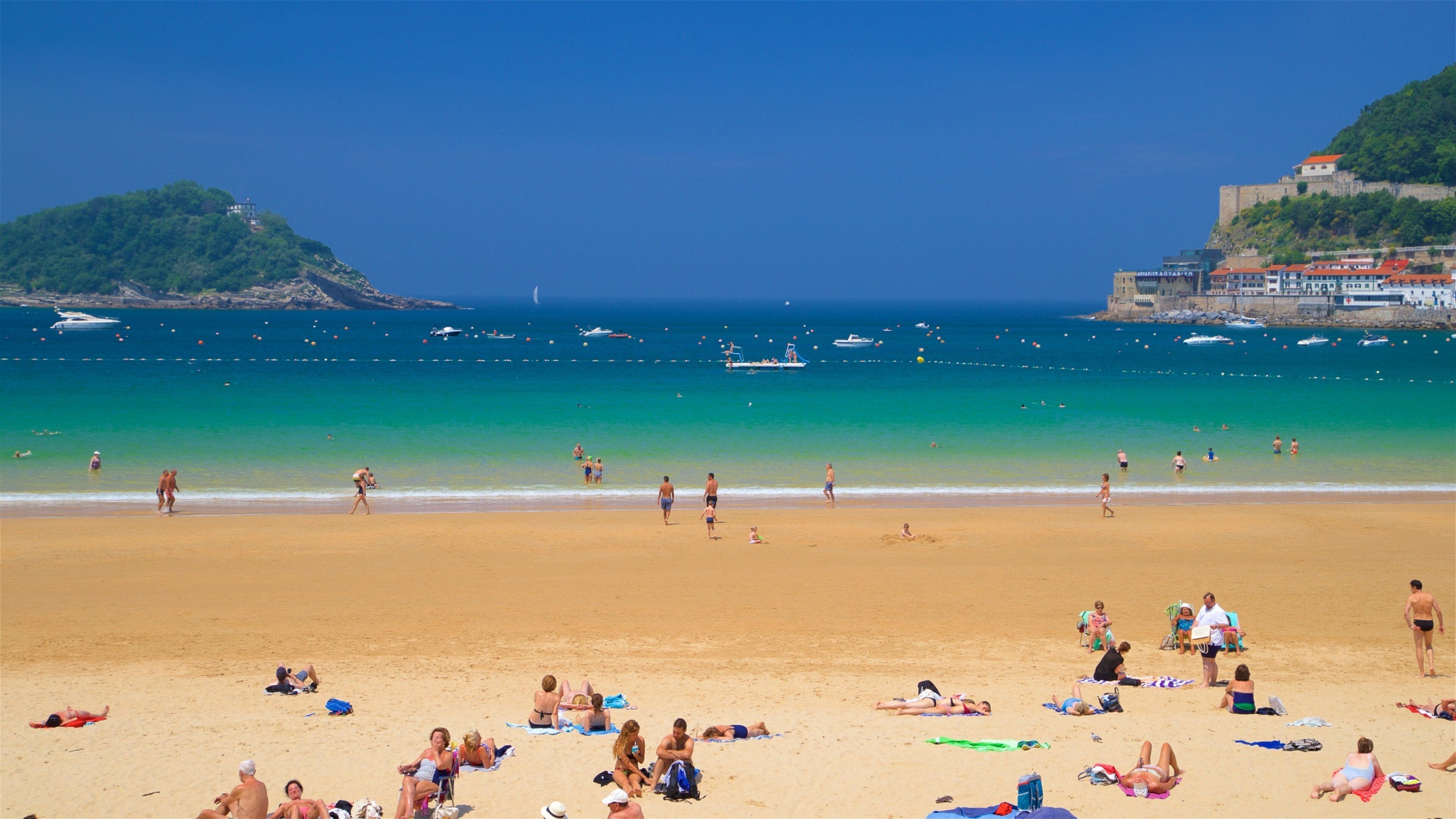 Concha Beach featuring a sandy beach, a coastal town and general coastal views