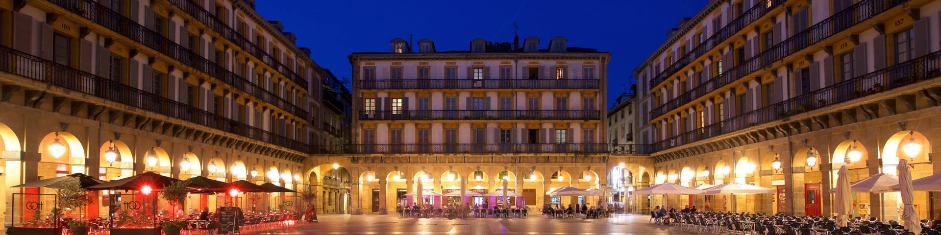Plaza de La Constitucion which includes a square or plaza, heritage elements and night scenes