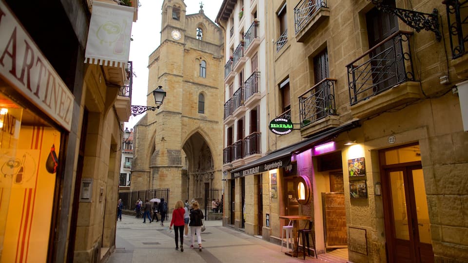 San Vicente Church which includes street scenes and heritage elements as well as a small group of people