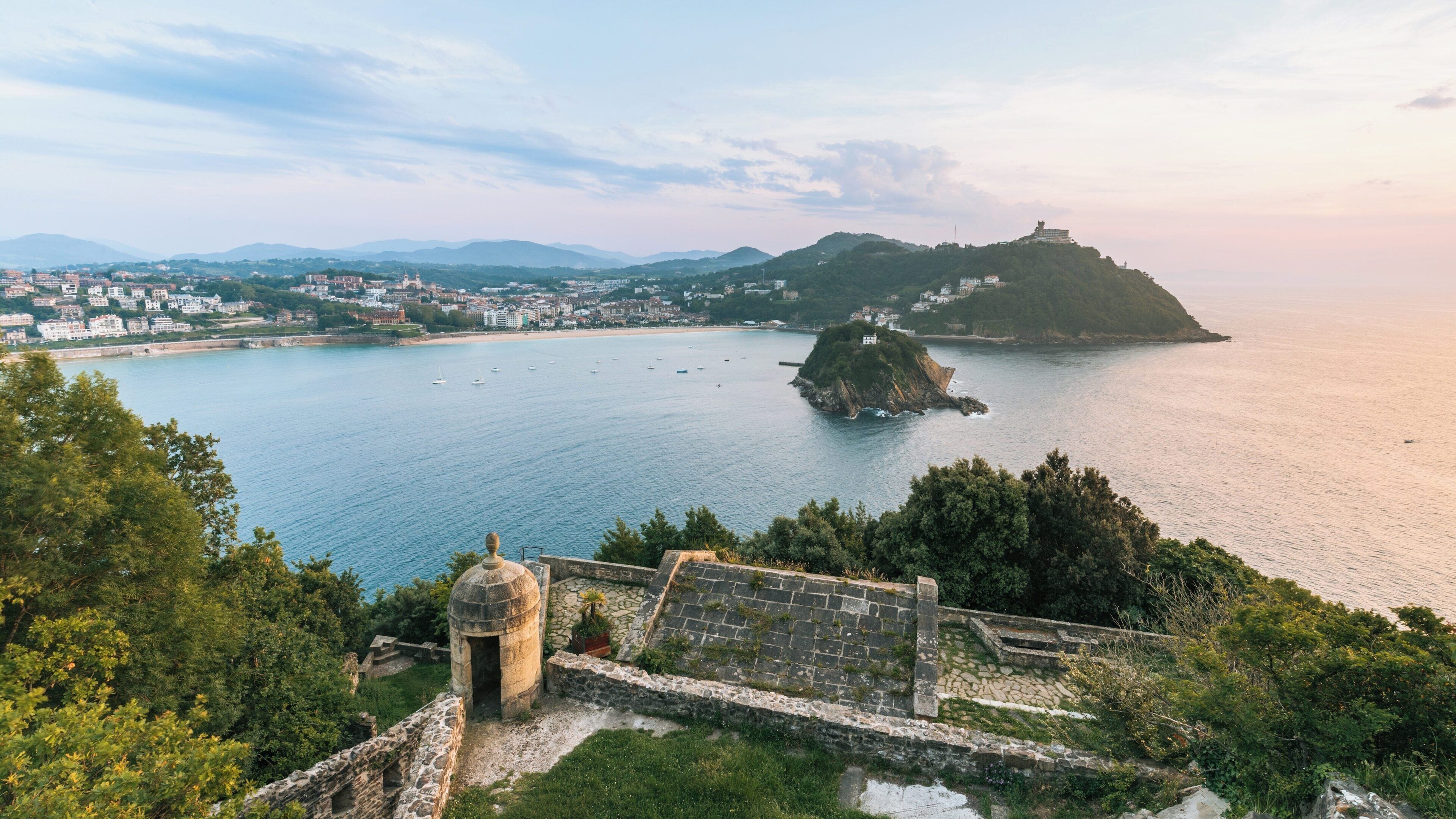Majestic view of Monte Urgull overlooking Old Town San Sebastian during sunset