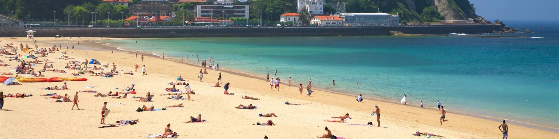 Ondarreta Beach featuring a sandy beach, a coastal town and general coastal views