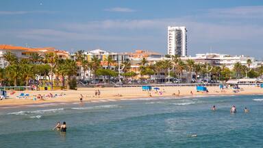 Cambrils Beach which includes a coastal town, swimming and general coastal views