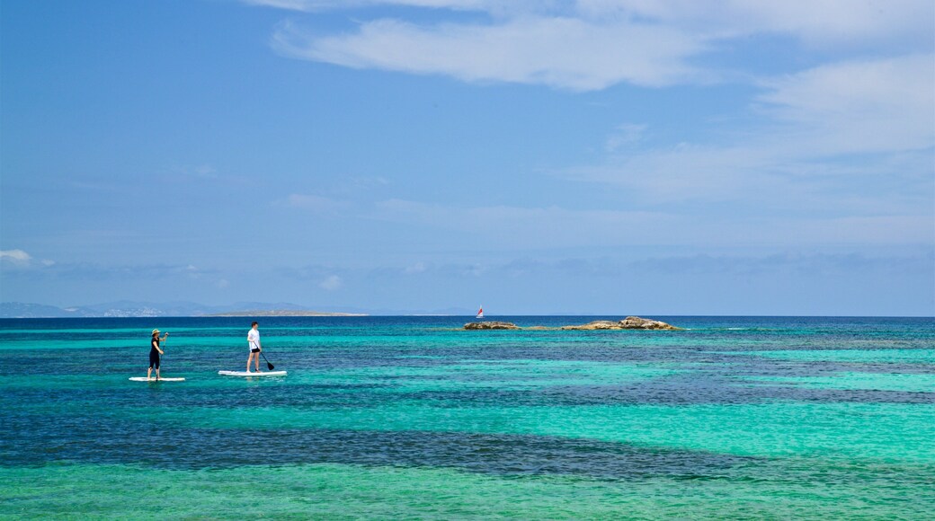 Es Pujols Beach featuring kayaking or canoeing, tropical scenes and general coastal views