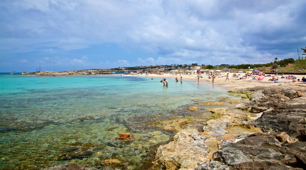 Es Pujols Beach which includes rocky coastline, general coastal views and swimming