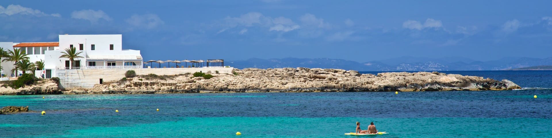 Es Pujols Beach which includes general coastal views, tropical scenes and rugged coastline