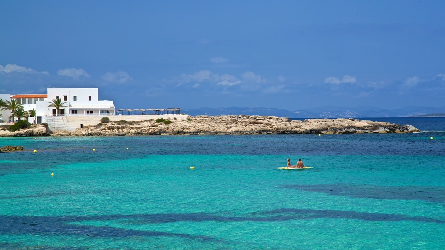 Es Pujols Beach which includes general coastal views, tropical scenes and rugged coastline