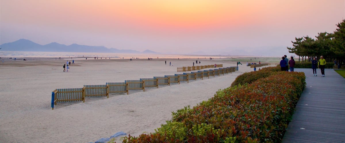 Dadaepo Beach featuring a beach, a sunset and general coastal views