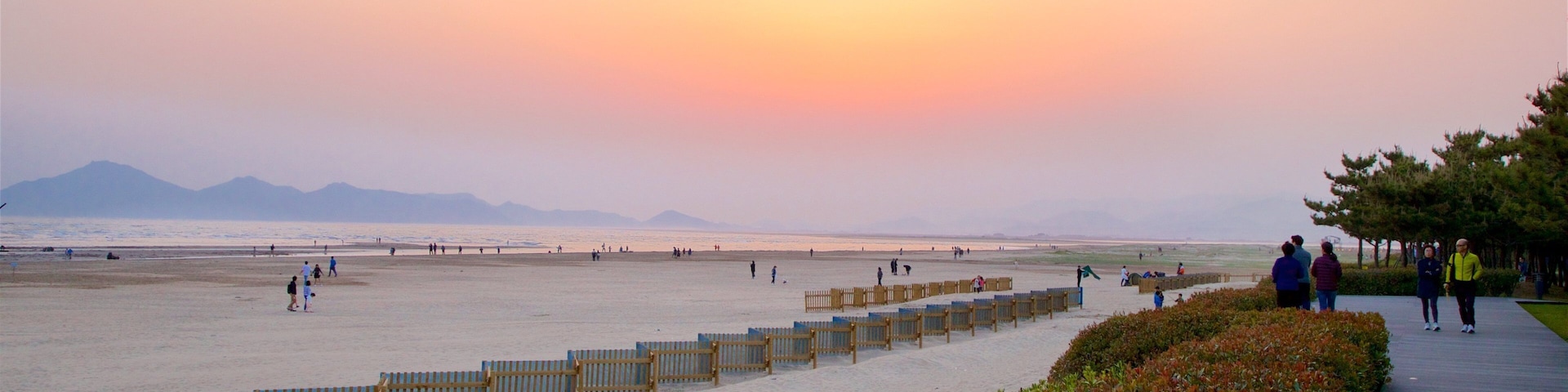 Dadaepo Beach featuring a beach, a sunset and general coastal views