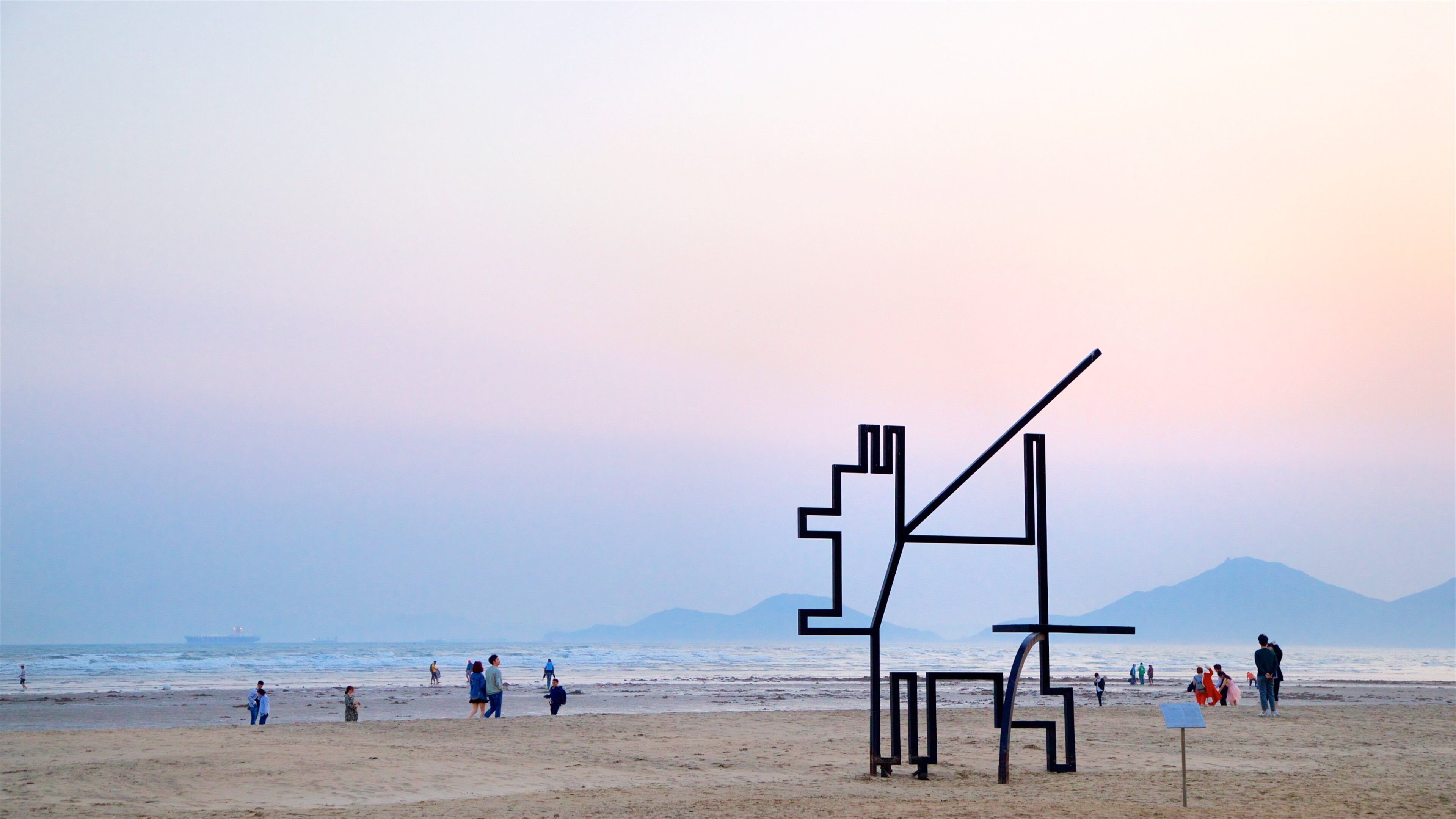 Dadaepo Beach which includes a beach, a sunset and outdoor art