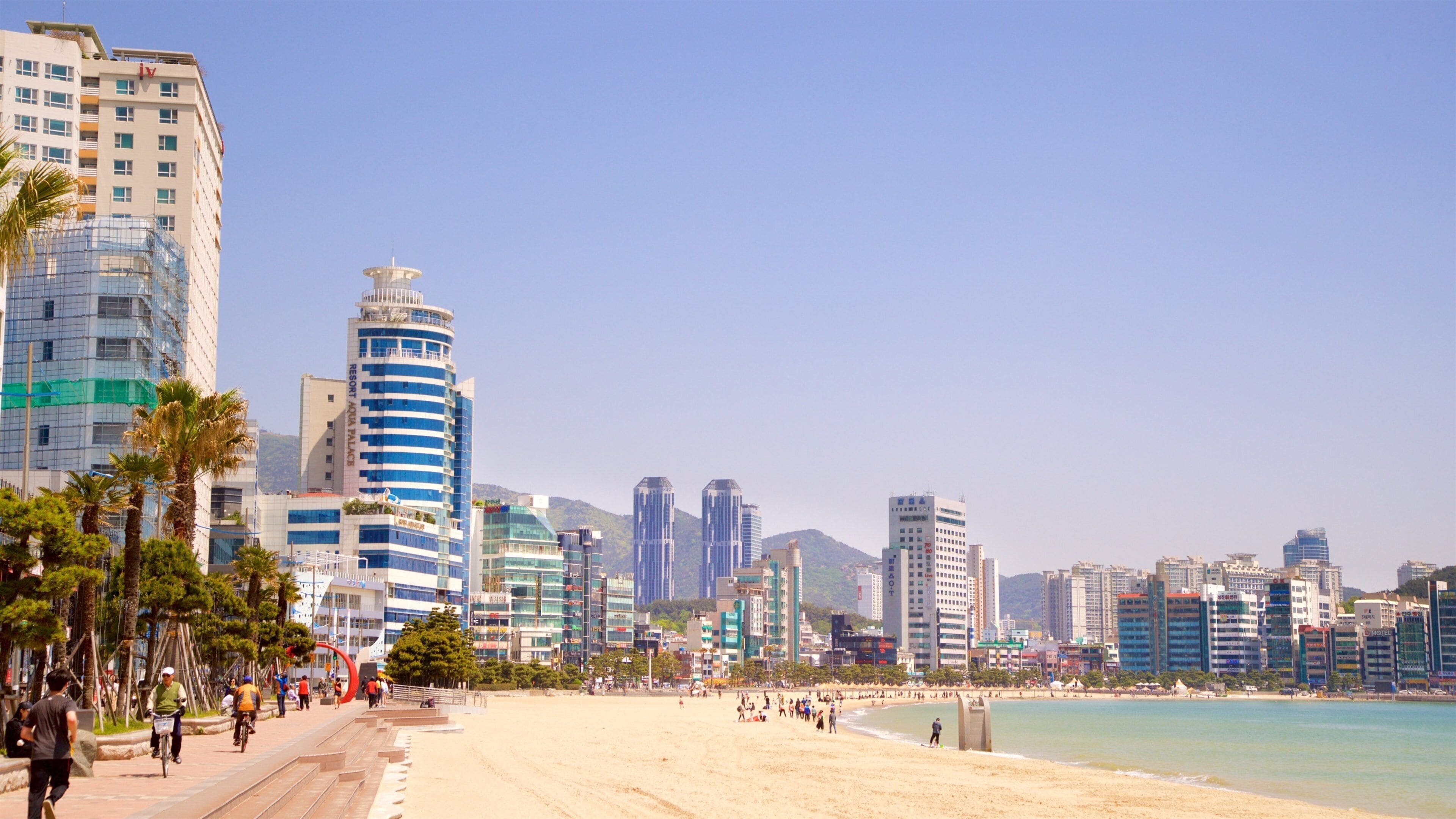 Gwangalli Beach showing a sandy beach, a city and a coastal town