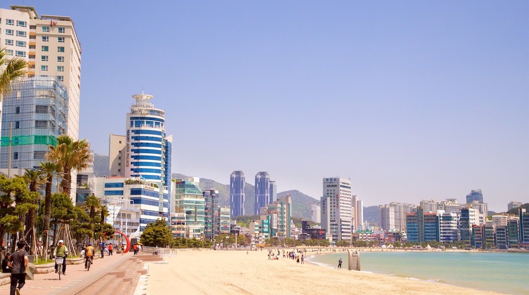 Gwangalli Beach showing a sandy beach, a city and a coastal town